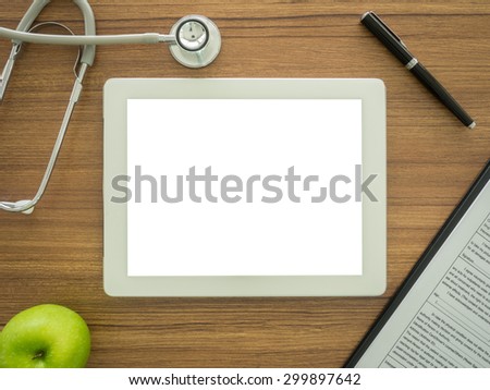 free space for text in tablet computer on desk\'s doctor. top view