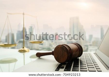 law legal technology concept.  judge gavel on computer with scales of justice on desk of lawyer. 商業照片 © 