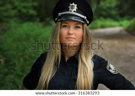 Beautiful  Police Girl posing in park and at the police station