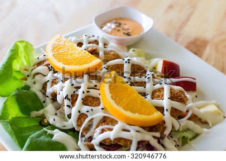Fried fish salad.select focus and Clear focus on specific areas of the image./ soft Focus