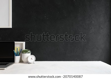 Similar – Image, Stock Photo Minimalist home office closeup concept with tiny cactus in white ceramic pot on wooden ring for air purification to help promote productivity