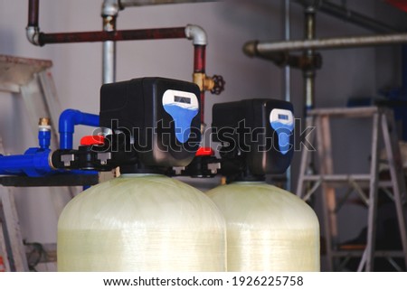 Install a water softener tank system inside the building. Foto stock © 