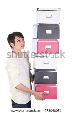 Young office woman with six archive document boxes in hands, on white background