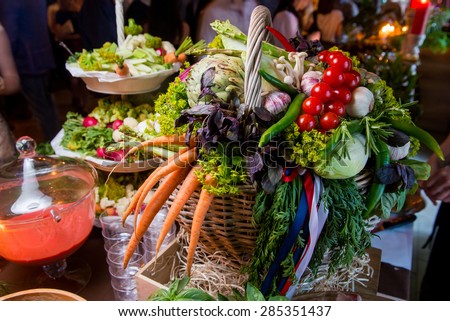 Lots of fresh vegetables in a basket on a table in the restaurant salt bar/Vegetarian basket of vegetables.