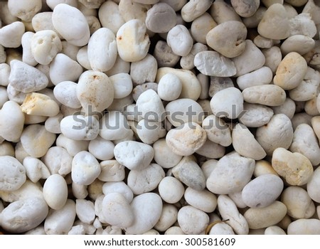 Abstract background with decorative floor pattern of white gravel stones, Gravel texture