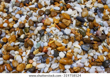 Abstract background with decorative floor pattern of white gravel stones, Gravel texture