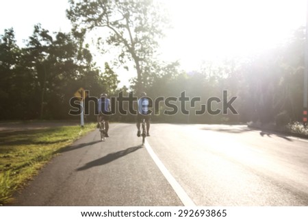 exploring thailand by bicycle in the strong sunlight at evening and soft light background and blurry light background