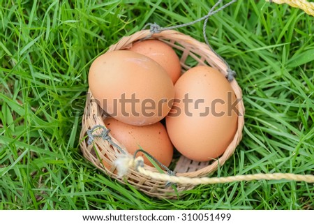 eggs and egg basket and a basket of bamboo strips