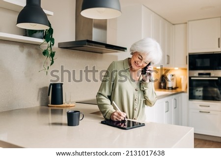 Similar – Image, Stock Photo Businesswoman making notes during workday at home