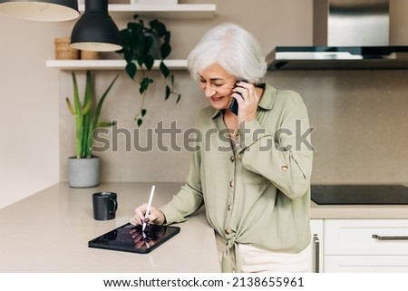 Similar – Image, Stock Photo Businesswoman making notes during workday at home