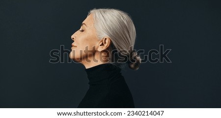 Similar – Image, Stock Photo mature woman with grey hair using tarot cards to predict future