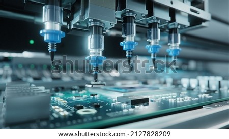 Automatic Pick and Place machine quickly installs Components on Generic Circuit Board. Electronics and Circuit board Manufacturing. Bright Environment Foto d'archivio © 