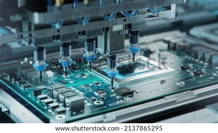 Automatic Pick and Place machine quickly installs Components on Generic Circuit Board. Electronics and Circuit board Manufacturing. Bright Environment ストックフォト © 