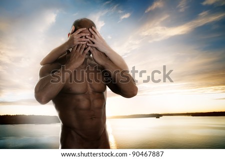 Muscular torso of man, shutting face with own and female hands
