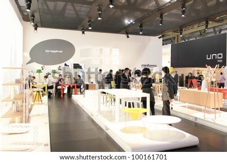 MILAN - APRIL 13: People look at interiors design and home architecture solutions during Salone del Mobile, international furnishing accessories exhibition on April 13, 2011 in Milan, Italy.