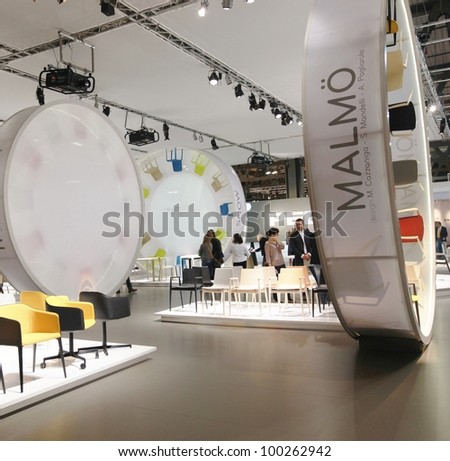 MILAN - APRIL 17: People visit look at interior design and home architecture solutions at Salone del Mobile, international furnishing accessories exhibition on April 17, 2012 in Milan, Italy.