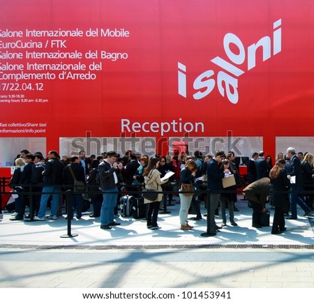 MILAN - APRIL 17: People crowd at exhibition reception before entering Salone del Mobile, international furnishing accessories exhibition on April 17, 2012 in Milan, Italy.