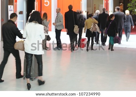 MILAN - APRIL 17: People enter Salone del Mobile, international furnishing accessories exhibition on April 17, 2012 in Milan, Italy.