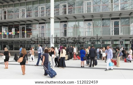 MILAN, ITALY - SEPTEMBER 09: People enter architecture and interior design exposition at Macef, International Home Show Exhibition on September 09, 2011 in Milan, Italy.