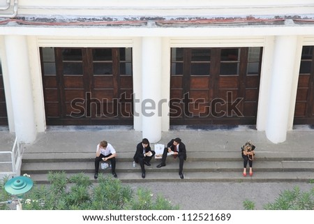 VENICE - SEPTEMBER 8: People during a break outside a Cinema during 69th Venice Film Festival on September 8, 2012 in Venice, Italy.