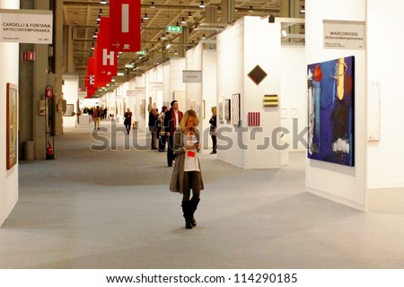 MILAN - MARCH 27: People walk trough work of arts galleries during MiArt ArtNow, international exhibition of modern and contemporary art March 27, 2010 in Milan, Italy.