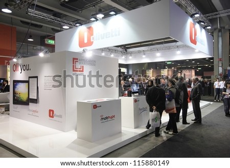 MILAN, ITALY - OCTOBER 17: People visit Olivetti technologies products area at SMAU, international fair of business intelligence and information technology October 17, 2012 in Milan, Italy.