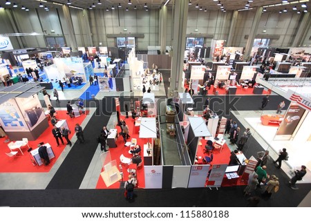 MILAN, ITALY - OCTOBER 17: People visit technologies products area at SMAU, international fair of business intelligence and information technology October 17, 2012 in Milan, Italy.