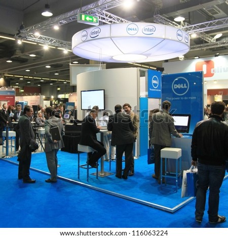 MILAN, ITALY - OCTOBER 17: People visit Intel technology products exhibition area at SMAU, international fair of business intelligence and information technology October 17, 2012 in Milan, Italy.