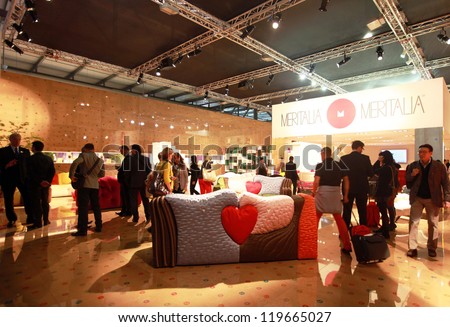 MILAN - APRIL 17: People visit interior design pavilions exhibition area of Salone del Mobile, annual international furnishing accessories exhibition on April 17, 2012 in Milan, Italy.