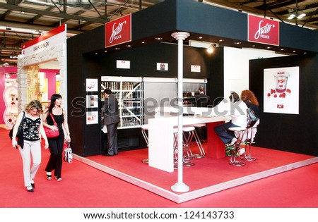 MILAN, ITALY - JUNE 10: People visiting the international food products stands at Tuttofood 2009, World Food Exhibition June 10, 2009 in Milan, Italy.