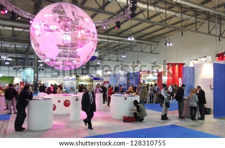 MILAN, ITALY - FEBRUARY 15: People at the light globe during BIT, International Tourism Exchange Exhibition on February 15, 2013 in Milan, Italy.