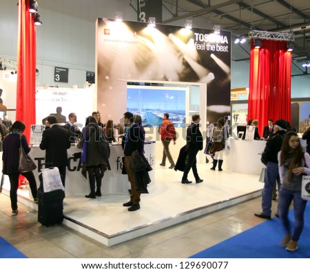 MILAN, ITALY - FEBRUARY 15: People visiting Tuscany tourism exhibition area at BIT, International Tourism Exchange Exhibition on February 15, 2013 in Milan, Italy.