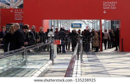 MILAN - APRIL 10: Crowd at the entrance of Salone del Mobile, international home furnishing and architecture design exhibition on April 10, 2013 in Milan, Italy.