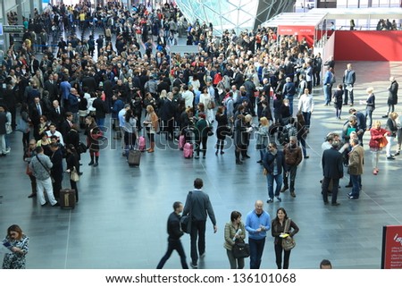 MILAN - APRIL 10: People at Auditorium area before entering Salone del Mobile, international home furnishing design and accessories exhibition on April 10, 2013 in Milan, Italy.