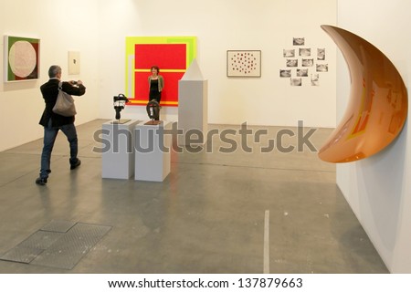 MILAN - APRIL 07: People visit sculpture and paintings gallery at MiArt, international exhibition of modern and contemporary art April 07, 2013 in Milan, Italy.