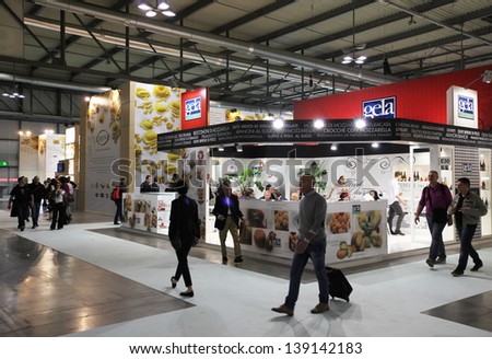 MILAN, ITALY - MAY 20: People visit local food productions exhibition stands at Tuttofood, Milano World Food Exhibition May 20, 2013 in Milan, Italy.