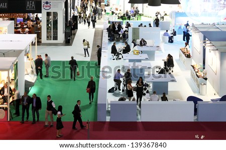 MILAN, ITALY - MAY 20: Panoramic view of people visiting local and national food productions exhibition area at Tuttofood, Milano World Food Exhibition May 20, 2013 in Milan, Italy.