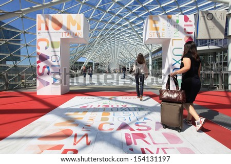 MILAN, ITALY - SEPTEMBER 13: Women at the entrance of Macef, International Home Show Exhibition on September, 13 2013 in Milan, Italy.