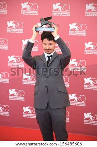 VENICE - SEPTEMBER 07: Actor winner of Golden Lion at young movies section poses for photographers during photocall at the 70th Venice Film Festival on September 07, 2013 in Venice.