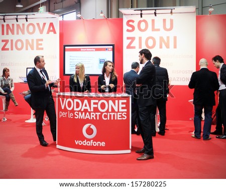 MILAN, ITALY - OCTOBER 17: People at Vodafone technologies products exhibition area at SMAU, international fair of business intelligence and information technology October 17, 2012 in Milan, Italy.