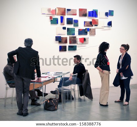 MILAN - APRIL 08: Peopl talking while visiting paintings galleries during MiArt, international exhibition of modern and contemporary art on April 08, 2011 in Milan, Italy