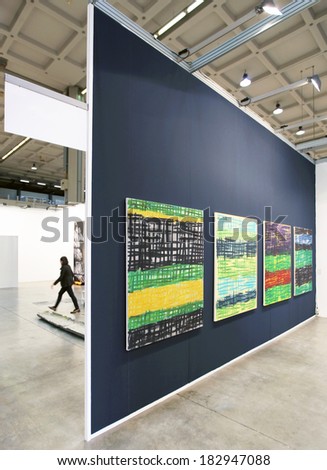 MILANO, ITALY - APRIL 07, 2013: Visiting a paintings gallery at MiArt, international exhibition of modern and contemporary art in Milano, Italy.
