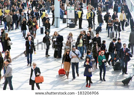 MILANO, ITALY - APRIL 10, 2013: People enter Salone del Mobile, international furnishing accessories exhibition at Rho Fiera Center in Milano, Italy.