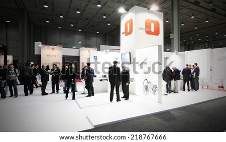 MILAN, ITALY - OCTOBER 20, 2010: People visit Olivetti products stands at SMAU, international fair of business intelligence and information technology in Milan, Italy.