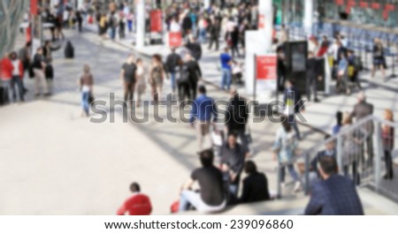 People crowd background with empty space on the left.