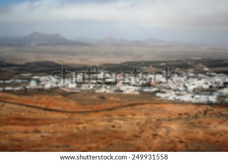 Village in a desert, panoramic view. Intentionally blurred editing blurred post production.