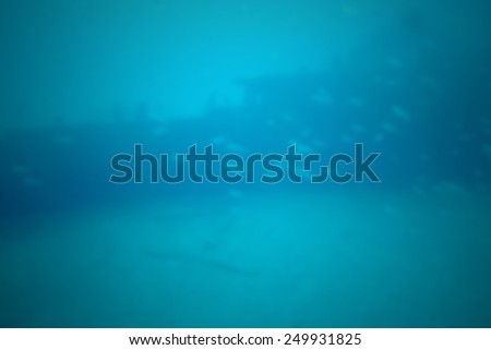 Sea bed with fish, deep blue background. Intentionally blurred editing postproduction background.