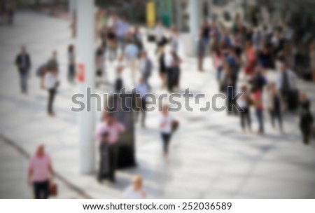 Commuters. Intentionally blurred editing post production. Humans not recognizable.