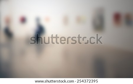 People at art gallery, generic background. Intentionally blurred editing post production.