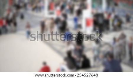 People at trade show, generic background. Intentionally blurred editing post production.